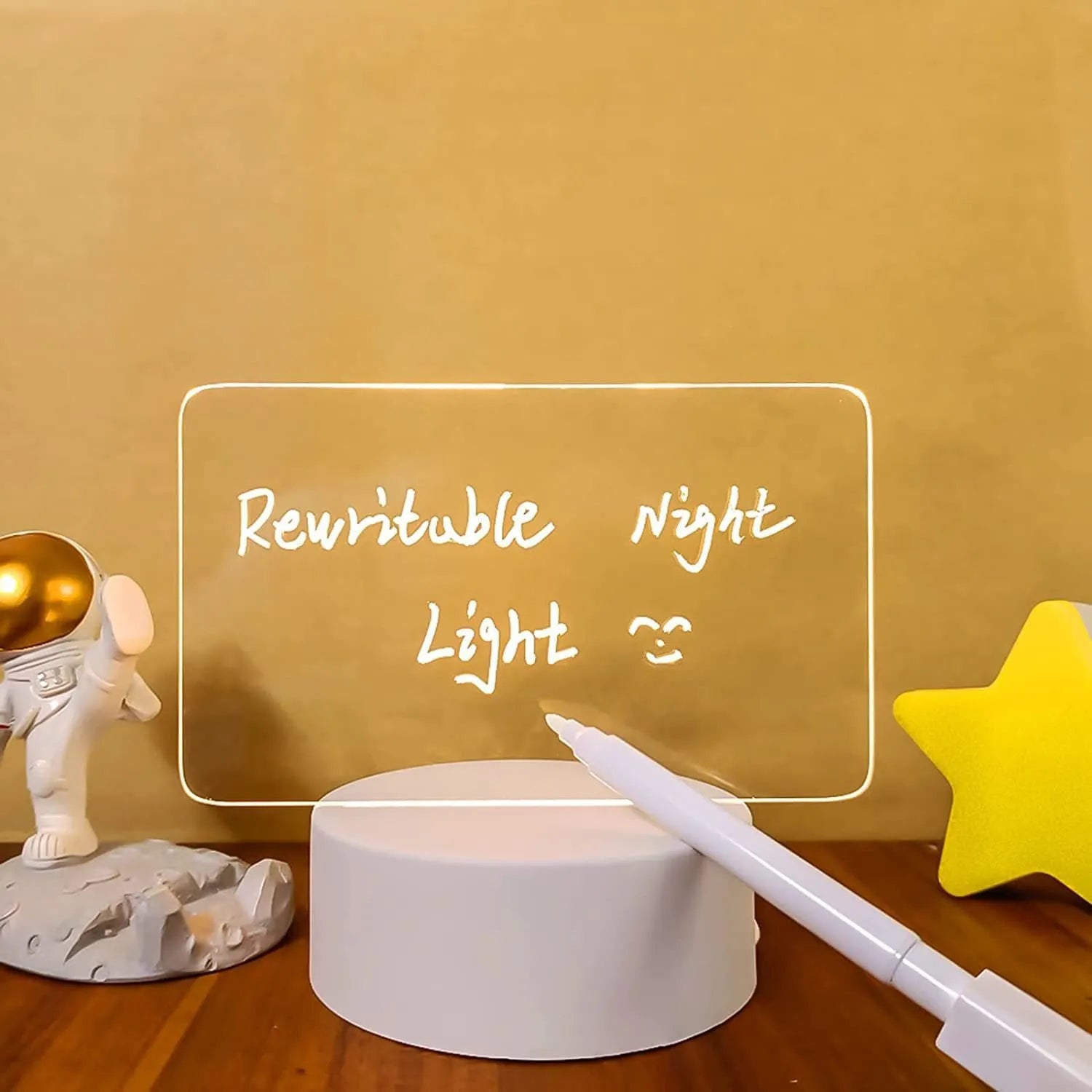 Acrylic message board night lamp with warm light showing round base and multiple picture shape options