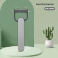 Green and grey dog de-matting combs in small and large sizes, showing angled stainless steel teeth.