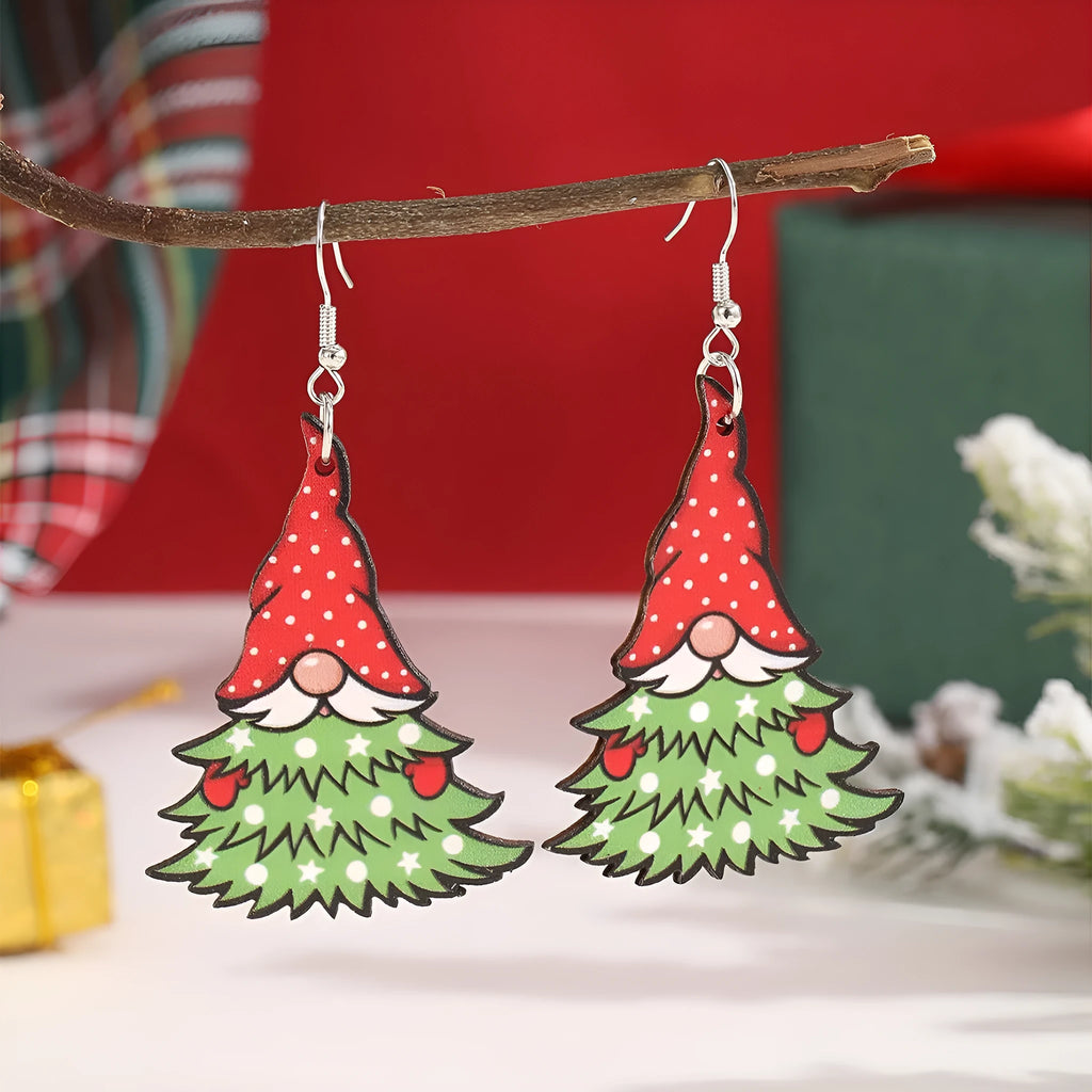Wooden geometric Christmas earrings with printed festive designs on a white background.