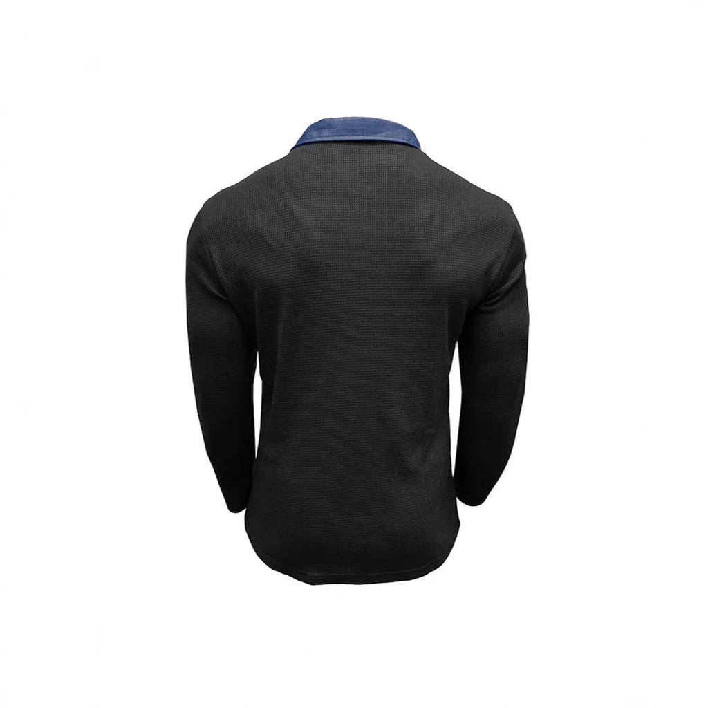 Man wearing a long-sleeved waffle-knit polo shirt in a solid colour with a loose, asymmetric retro fit.