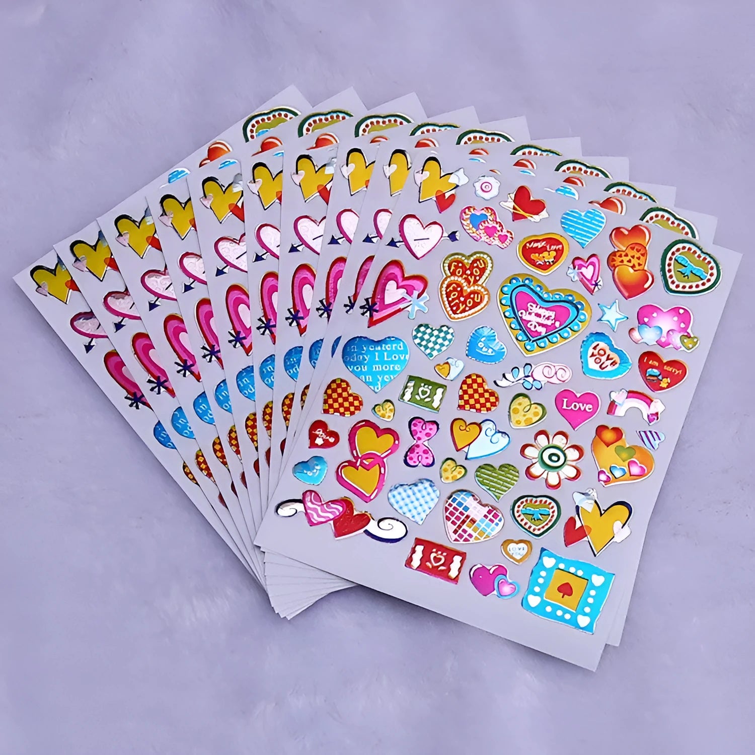 Pack of 100 waterproof gilding heart reward stickers with laser-cut edges on a backing sheet.