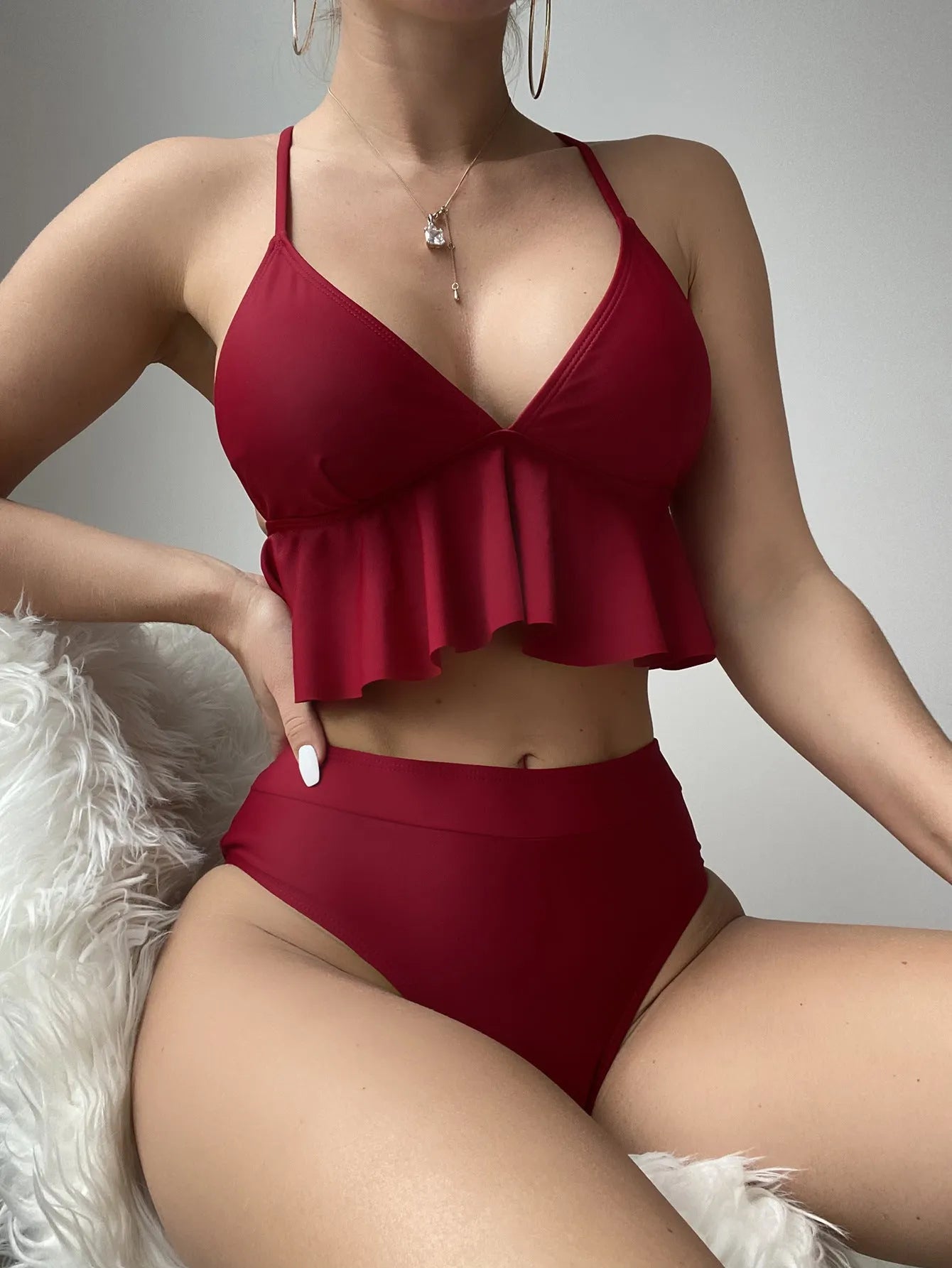 Women's solid colour split bikini swimsuit in polyester spandex fabric on mannequin