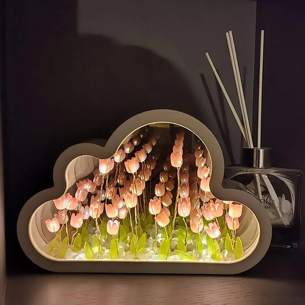 Pink DIY tulip night lamp with LED light and decorative mirror on a wooden desk.