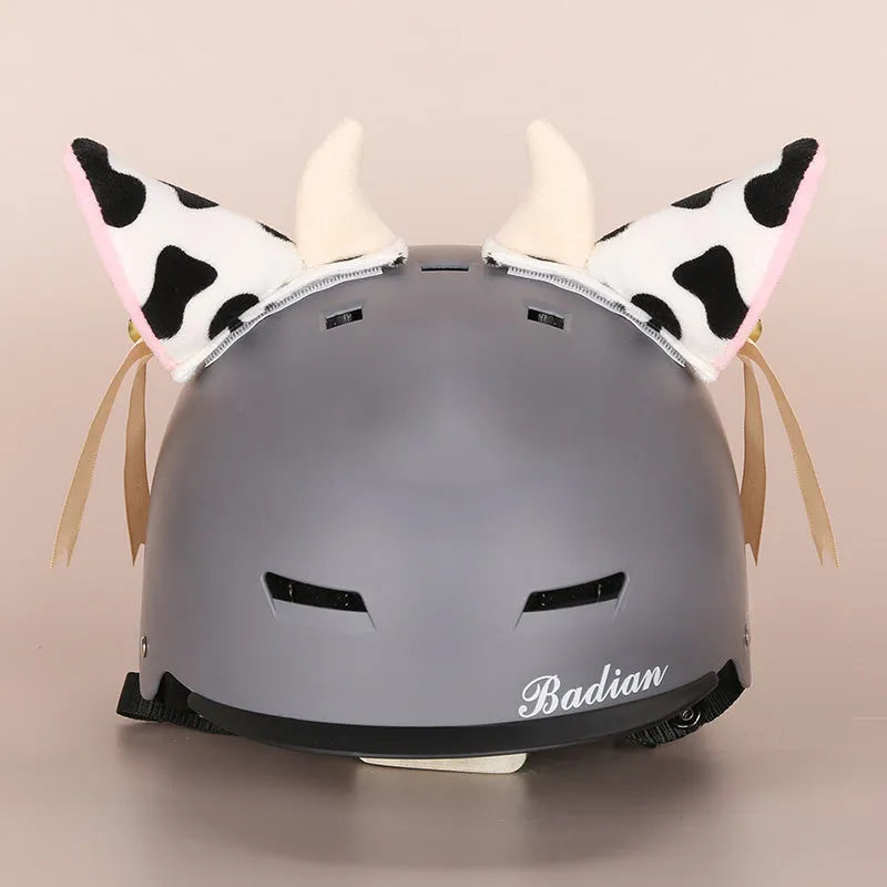 Soft plush cartoon character cover stretched over a pair of black on-ear headphones.