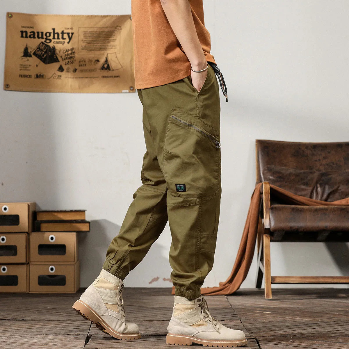 Men's cotton harem pants with tapered ankle cuffs in black colour showing loose fit and zip fly closure