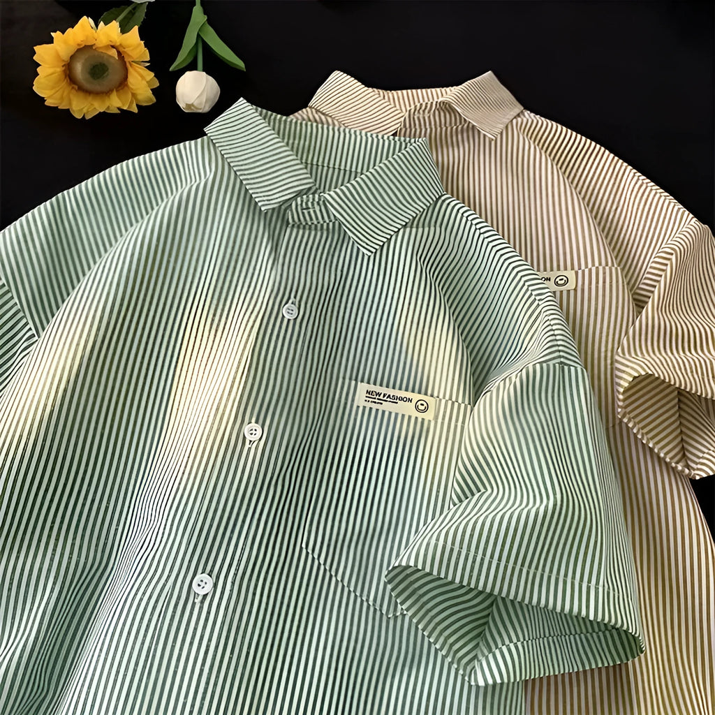 Blue and green striped loose fit plus size half sleeve shirt for women on a hanger