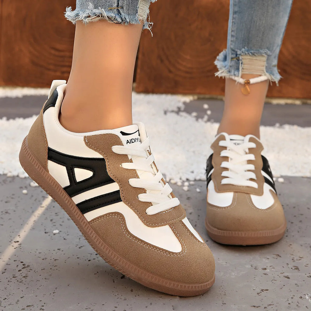Women's retro colour matching lace-up jogging shoes with platform heel and cross-strap detailing in black, grey, and khaki options