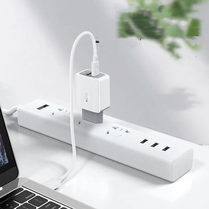 White phone fast charger set with USB cable on a white background.