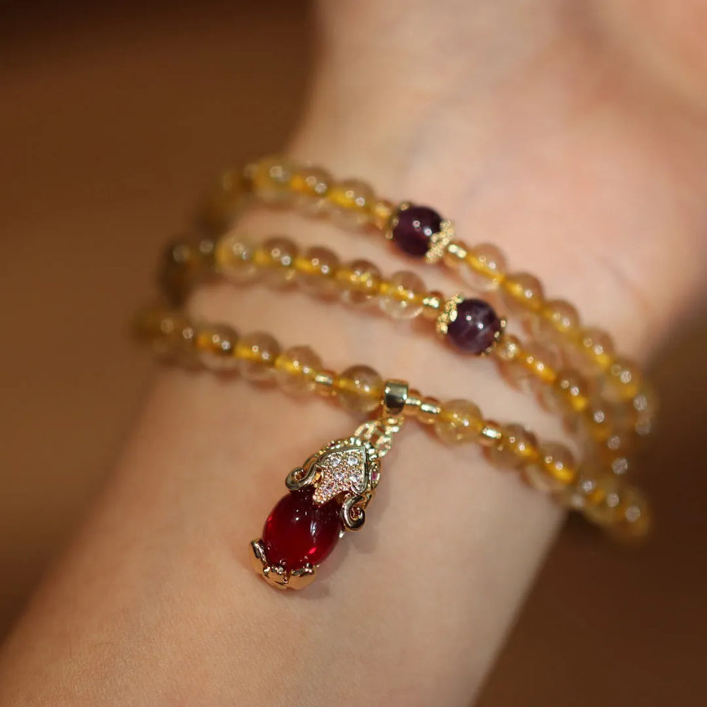 Natural Brazilian gold rutilated quartz bracelet with three-circle Chinese design and hanging chopsticks decoration