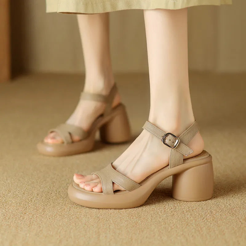 Women's apricot open-toe platform sandals with round toe holder and a light-coloured rubber sole on a plain background.