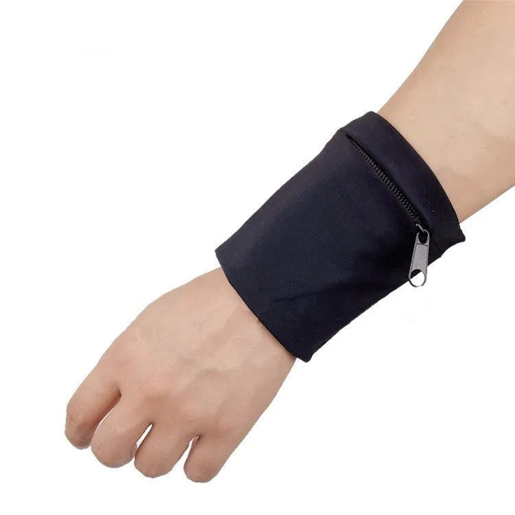 Black wrist sleeve bag with a mobile phone inserted, showing hands-free design on a person's wrist.