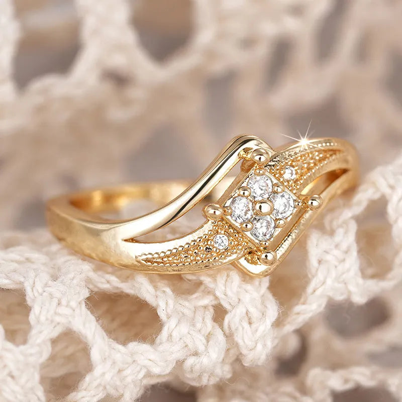Women's copper diamond ring with micro inlaid zircon ornament in yellow gold colour showing geometric design