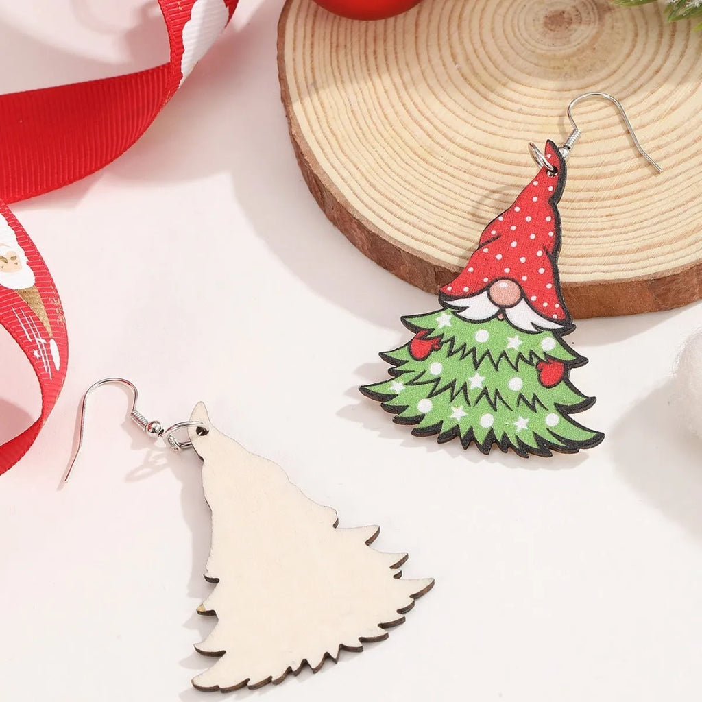 Wooden geometric Christmas earrings with printed festive designs on a white background.