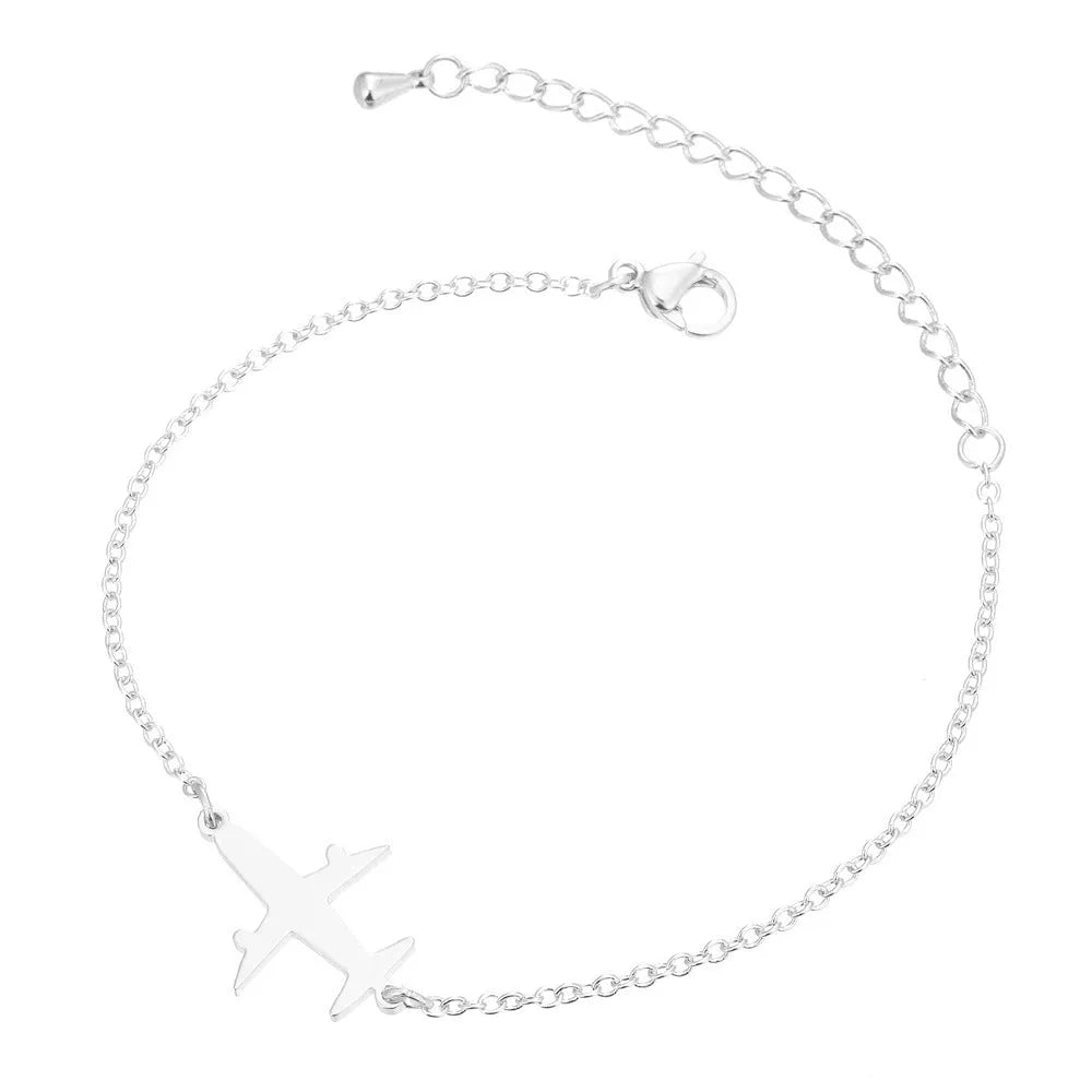 Alloy bracelet with simple airplane pendant in gold colour, unisex style