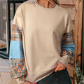 Beige and red plaid stitching women's long-sleeved loose-fit polyester top.