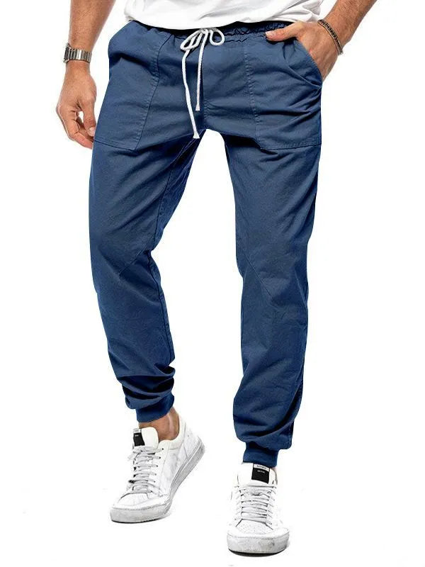 Men's loose tapered casual trousers with drawstring waist and ankle bands in solid colour