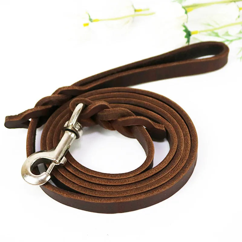Light brown cowhide dog walking rope with leather hand loop, shown at full length.