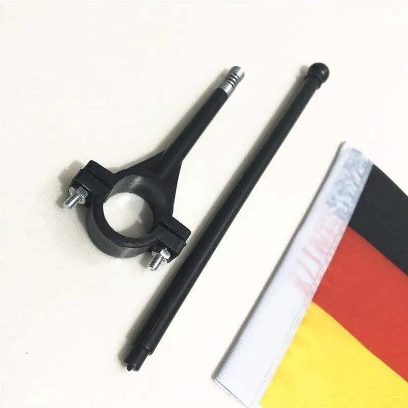 Square polyester flag on a plastic pole mounted to a bicycle handlebar