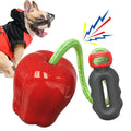 Green and red plastic dog food dropping ball toy in apple designs for chewing and outdoor play.