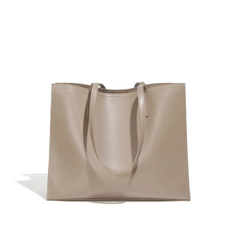 Women's brown genuine leather one shoulder handbag with multiple interior compartments