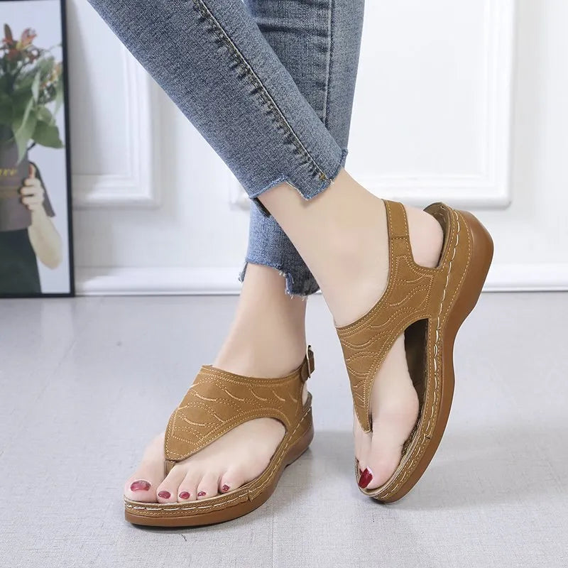 Women's wedge heel casual sandals in red with an adjustable back strap and flip-flop style.