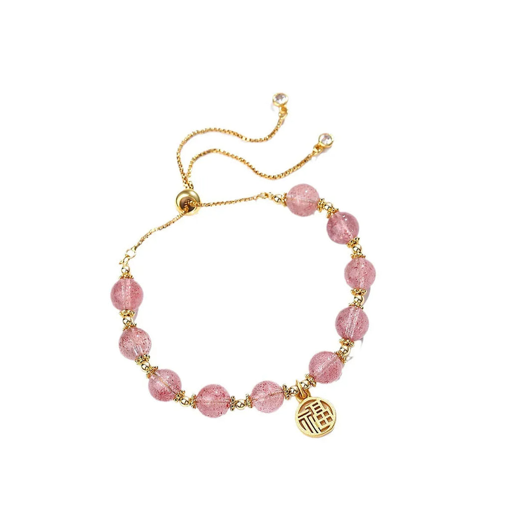 Women's Strawberry Quartz crystal bracelet with geometric shape and fu character design on an electroplated chain.