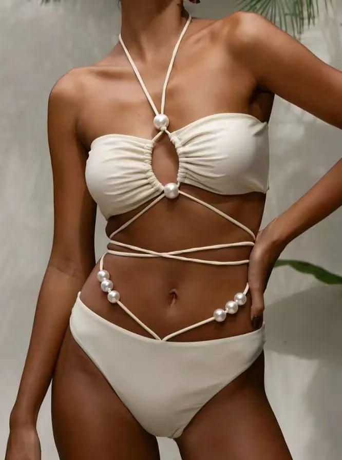 Black women's lace-up bikini swimsuit with separate bra and shorts pieces on mannequin