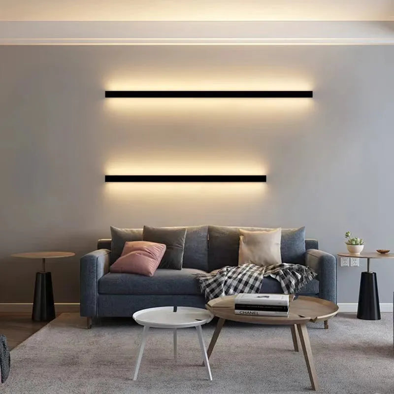80cm long black aluminium LED wall lamp with touch control for three light colours on a plain wall.