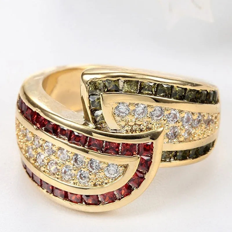 Gold-coloured peridot fashion ring for women on a white background.