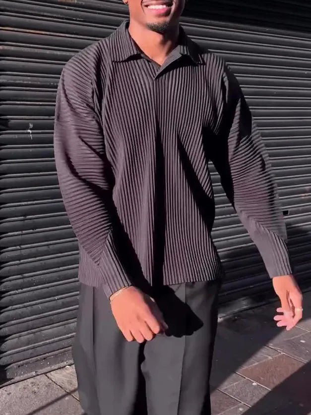 Man wearing a black pleated long-sleeved casual polyester top