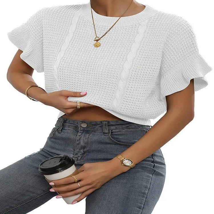White twisted string knitted pullover sweater with ruffled short sleeves on a hanger.