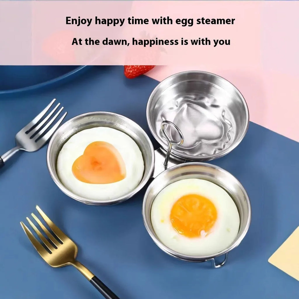 Mini heart-shaped and round stainless steel egg steamer with cooker base on a kitchen counter.