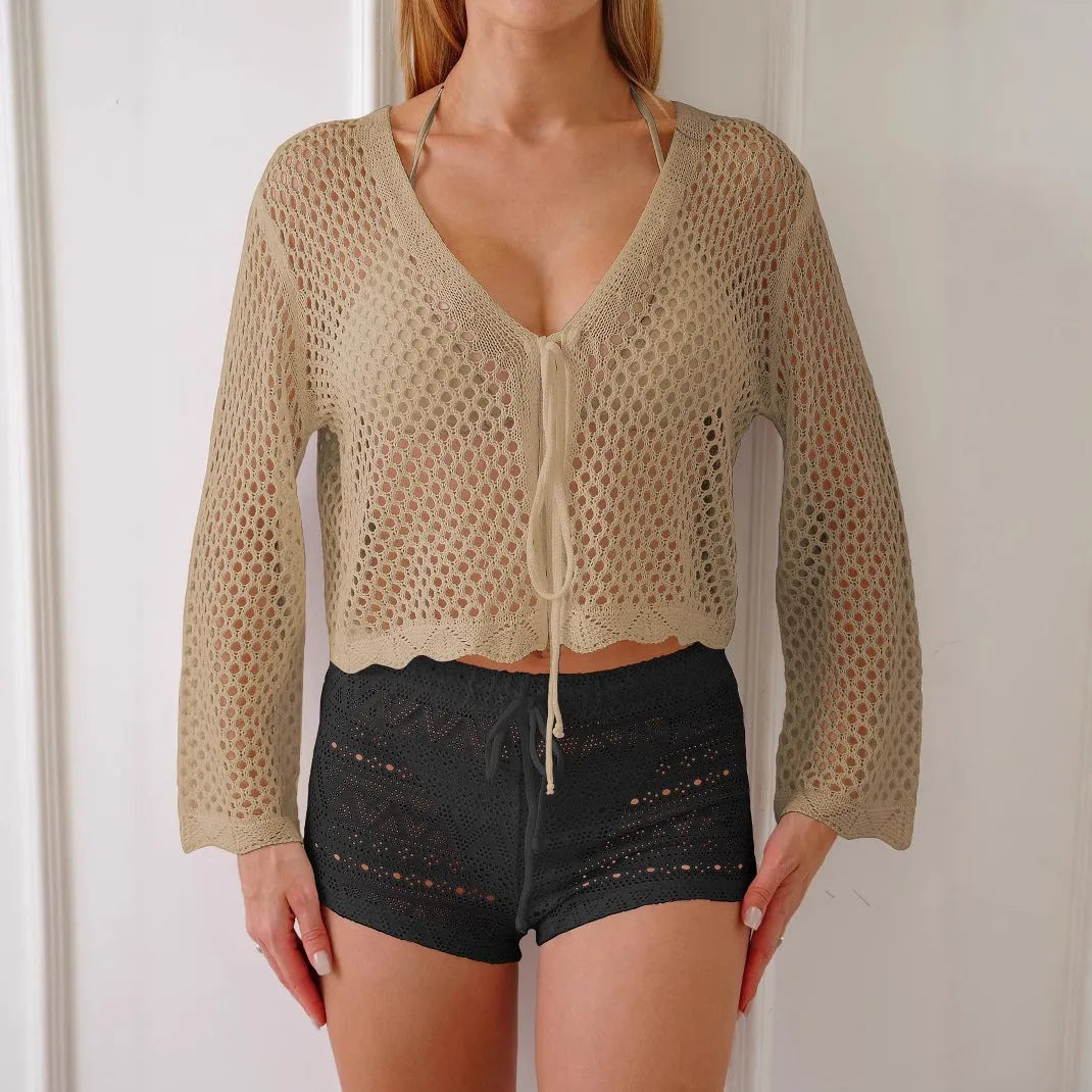 Short length women's cardigan blouse with bell sleeves in apricot colour.