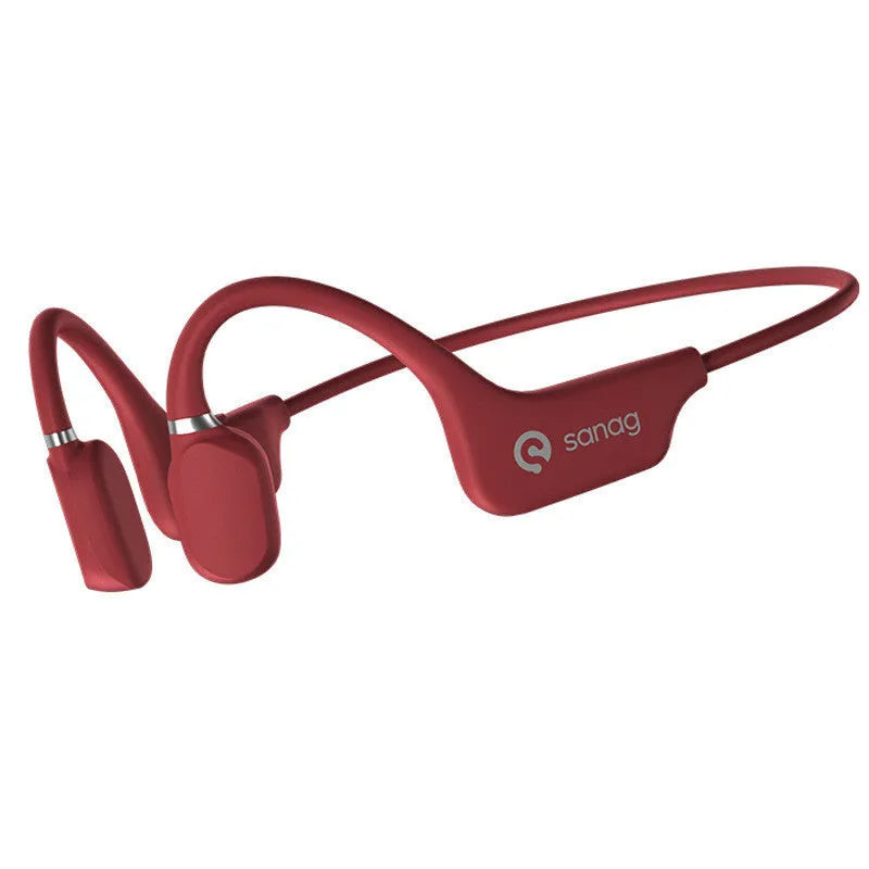 A person wearing black bone conduction Bluetooth headphones around their neck during a run.