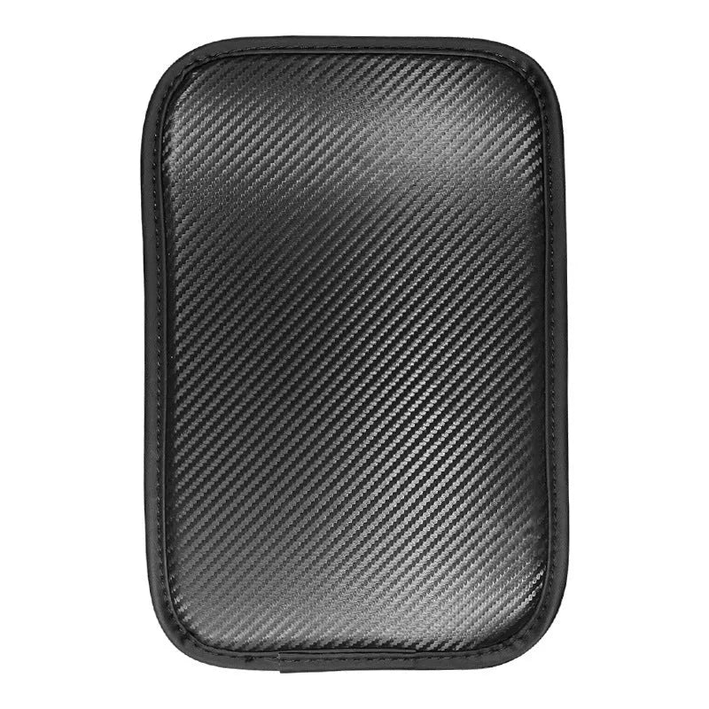 Leather car armrest cushion with carbon fibre pattern in red, shown on a car centre console.