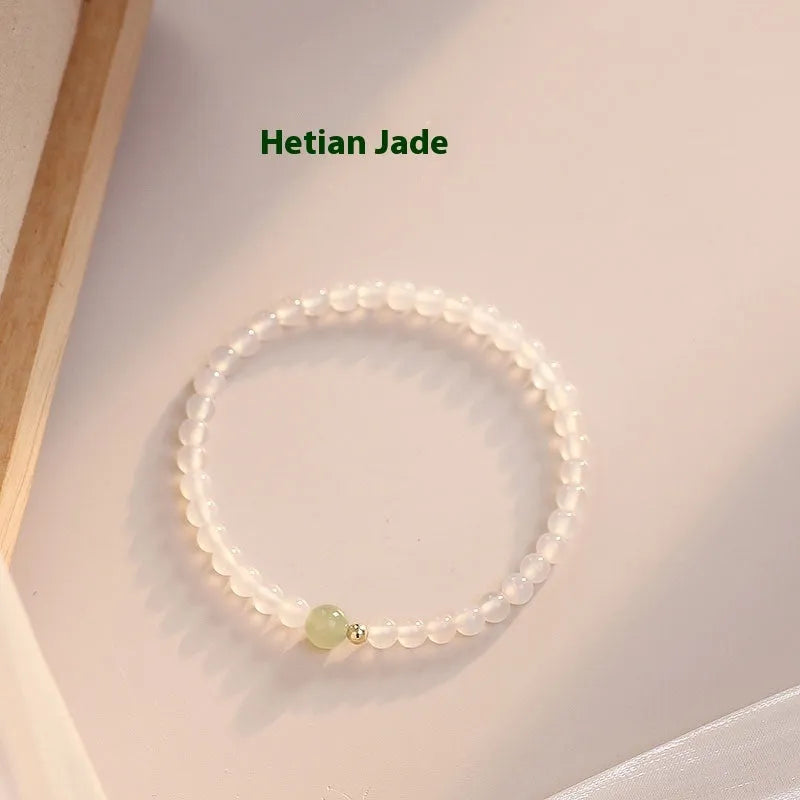 Natural white agate women's bracelet on wrist showing handmade beads and 15cm length.