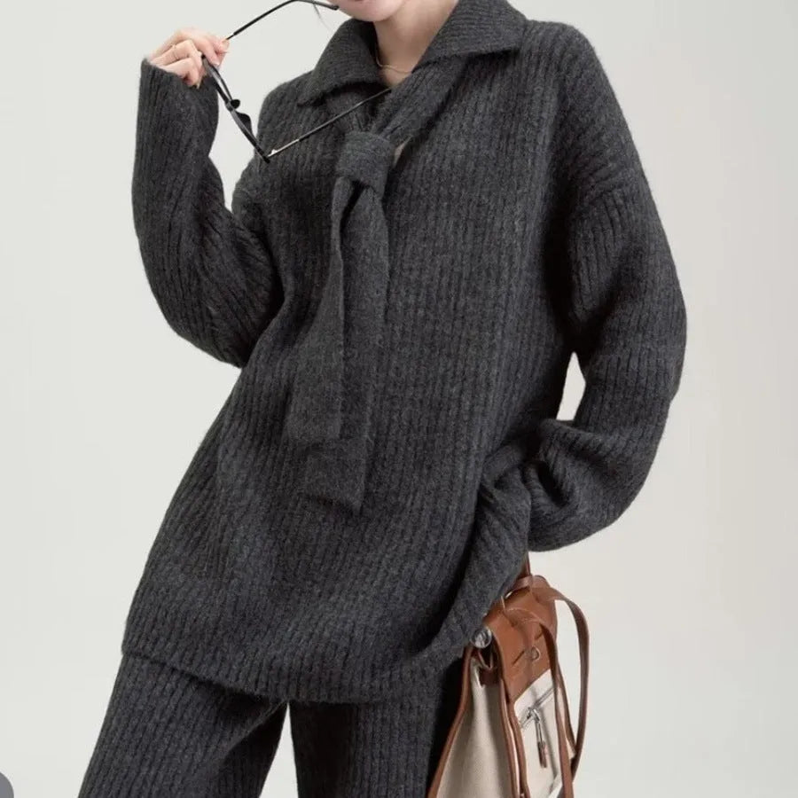 Women's beige knit two-piece set with long-sleeve top and trousers featuring collage stitch detail