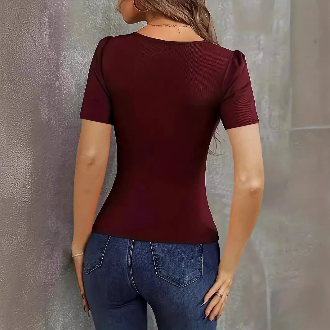 Women's slim fit knitted short sleeve pullover top in wine red colour on a hanger.