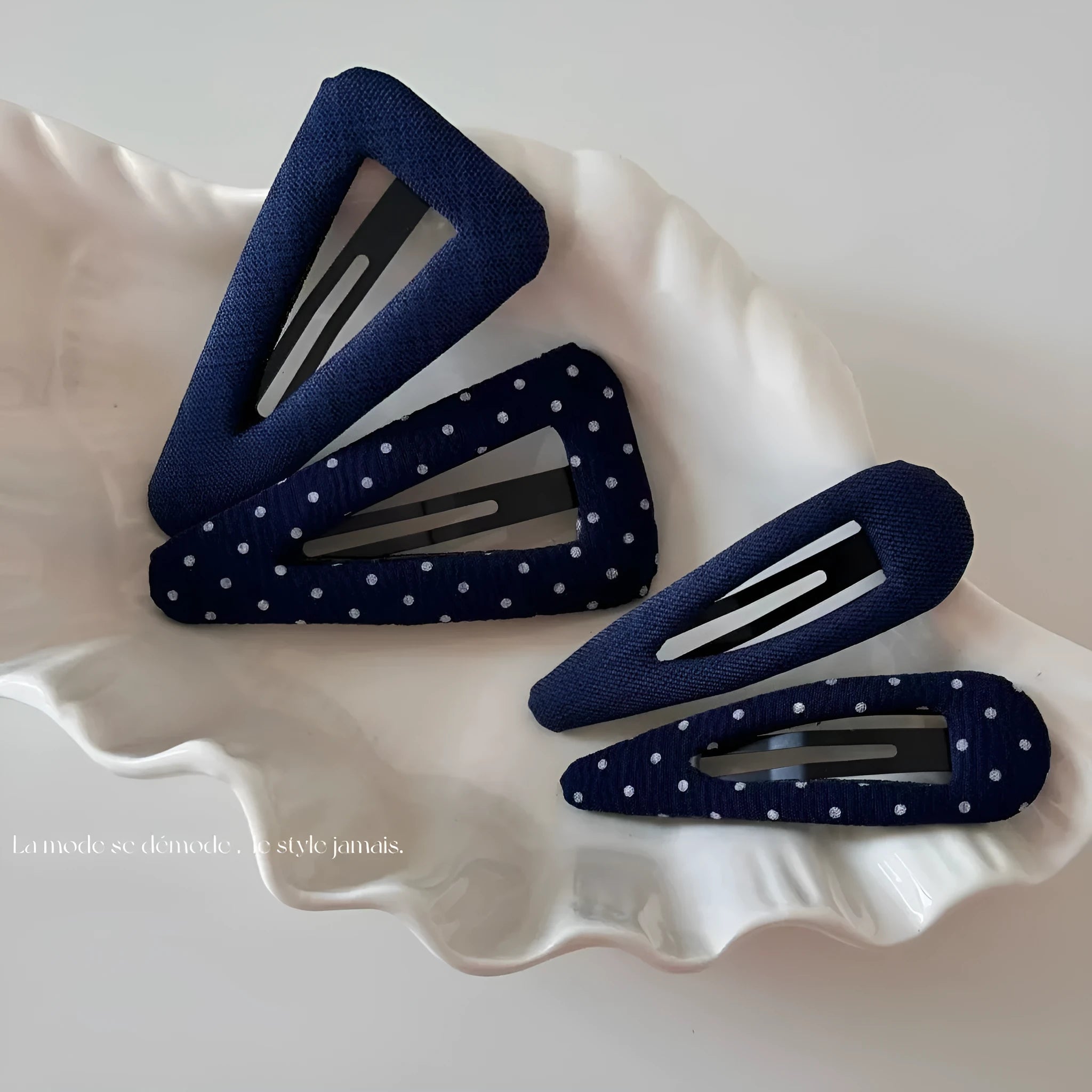 French retro style hair barrettes in triangle and water drop shapes with dark denim and polka dot patterns.