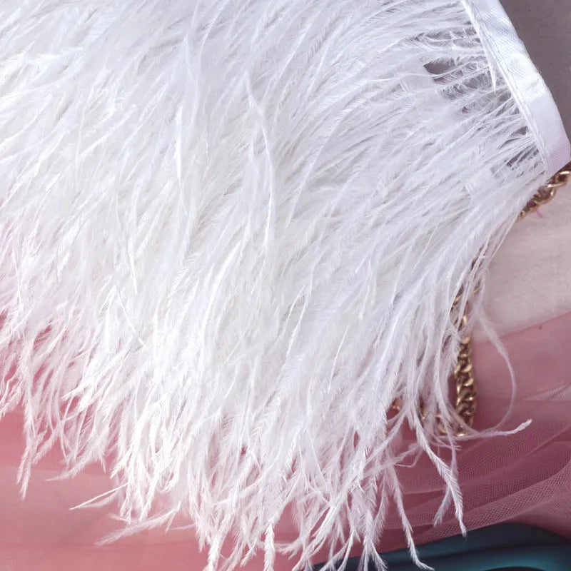 Decorative feather cloth strip in multiple colours including white, black, and mint green for DIY clothing and craft projects