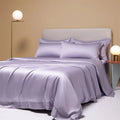 Luxury Tencel quilt cover and sheet set in Aurora Blue laid on a bed, showing deep pocket fitted sheet corner.