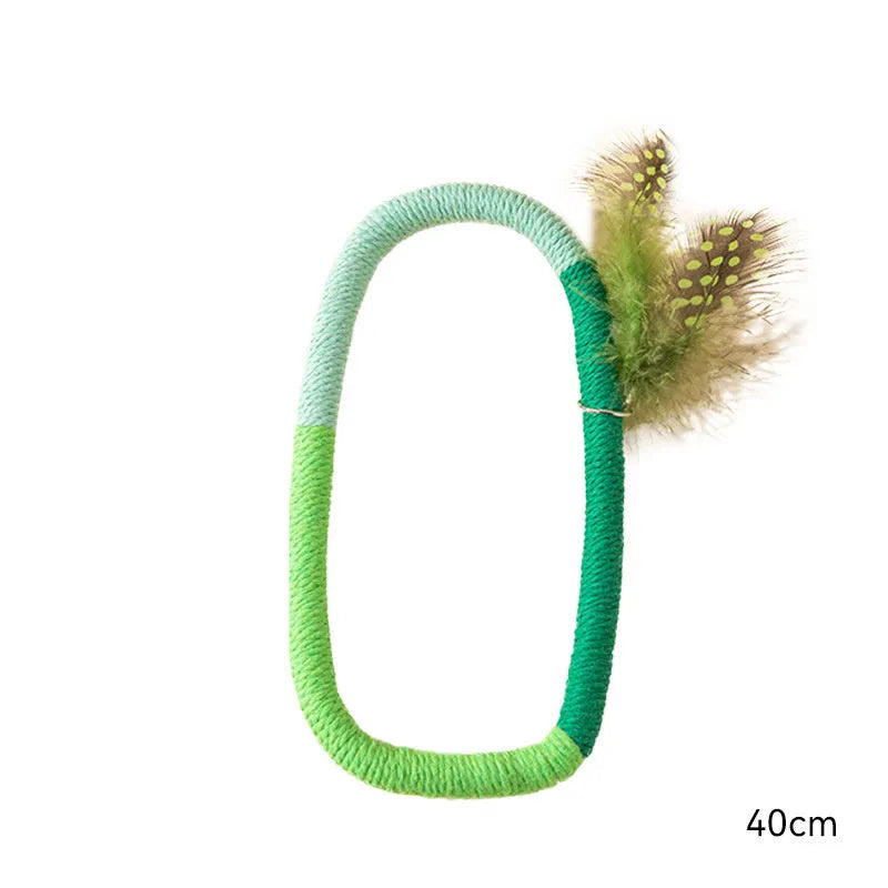 Green circular cotton rope cat toy with white feather attachments