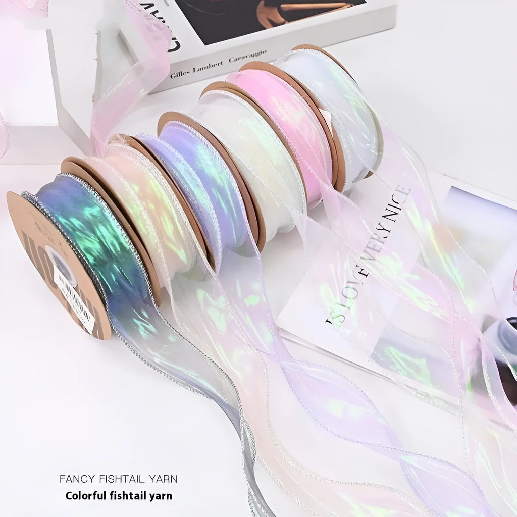 Roll of colourful wave patterned fishtail yarn decorative ribbon in mesh material, 4cm wide.