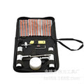 A cloth bag containing a 43-piece tire repair kit with 45 steel tools for puncture repairs.