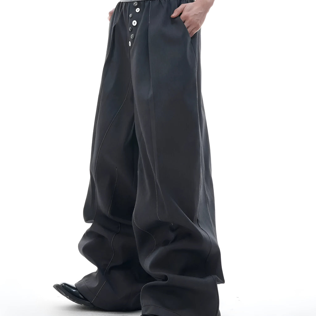 Drooping straight suit pants in black or grey with a high waist and button-open line detail.