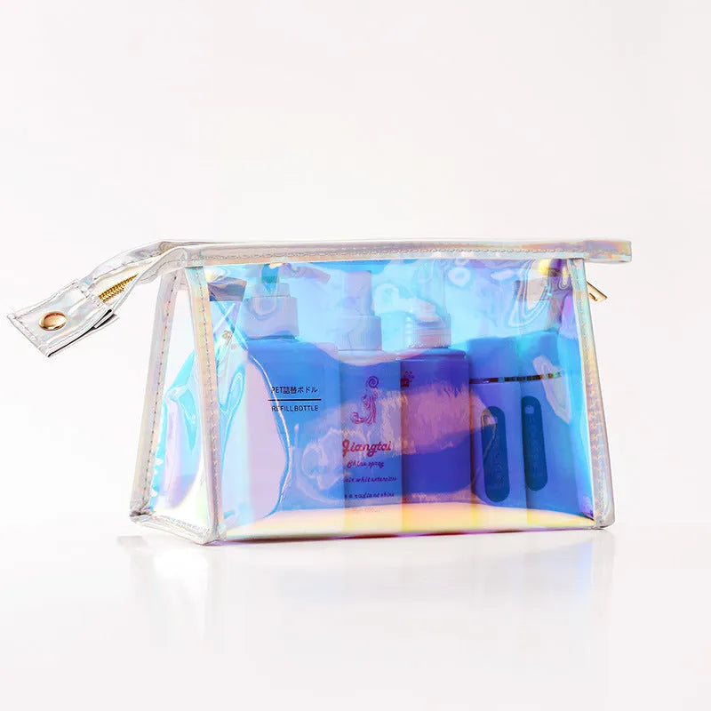 Transparent laser PVC cosmetic bag with zip closure, 22x7x14cm, on a flat surface
