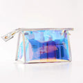 Transparent laser PVC cosmetic bag with zip closure, 22x7x14cm, on a flat surface