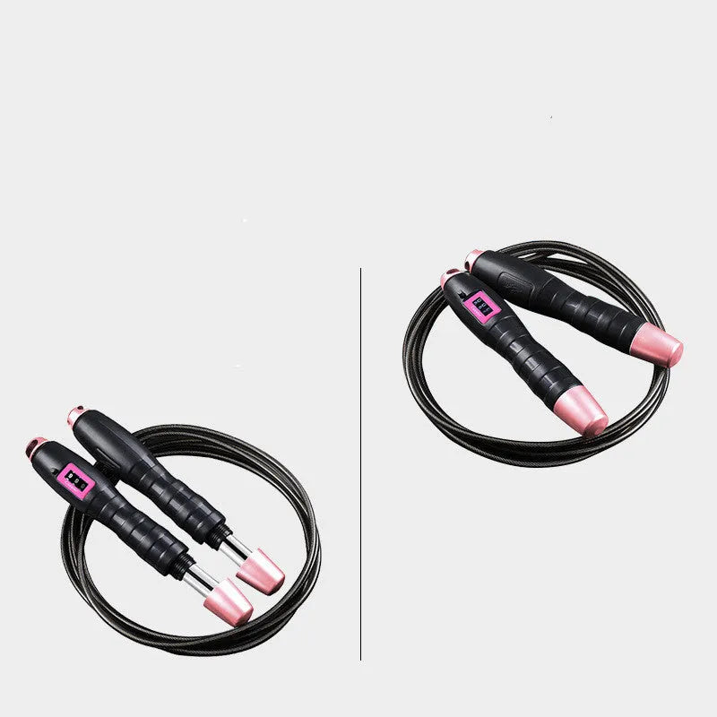 Adjustable digital skipping rope with black ABS handle and TPU coated steel cable on workout mat