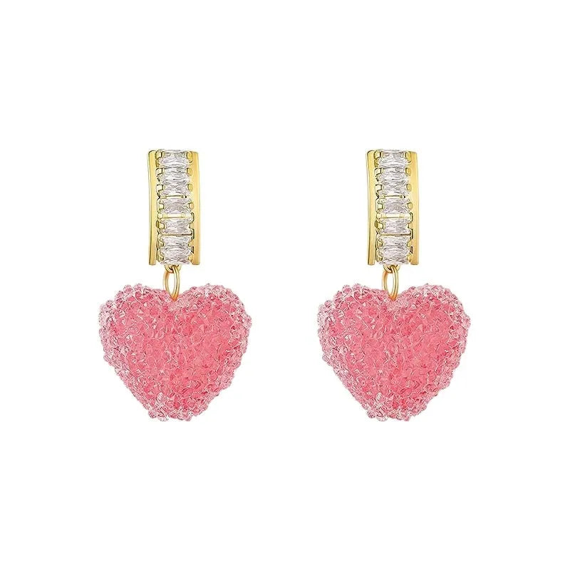 A pair of peach-shaped heart earrings with candy studs in either pink or blue colour.