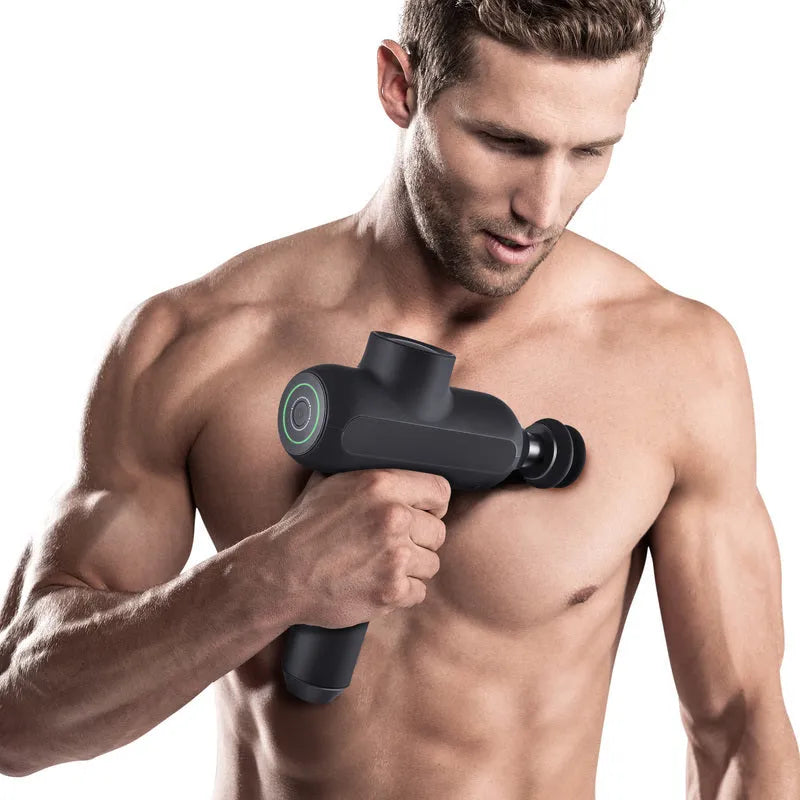 Black rechargeable muscle massager with 5 gear settings and 6 different massage head attachments.